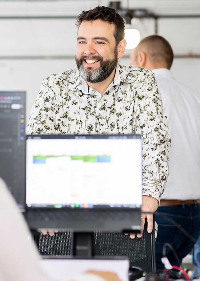 Employee smiling at desk